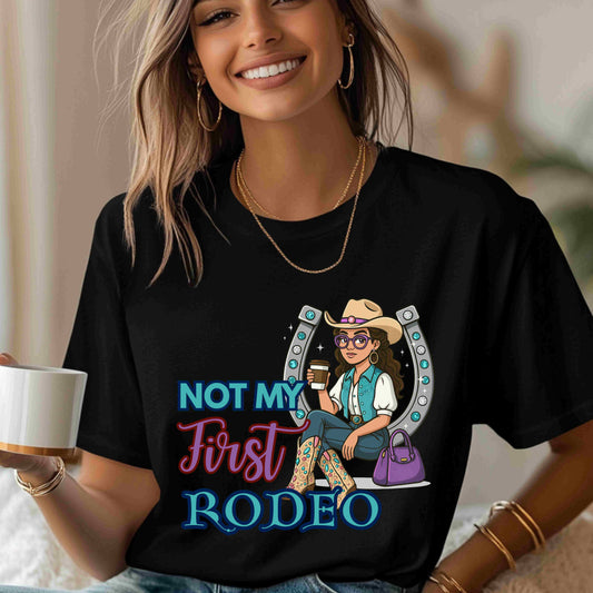 “Not My First Rodeo” Cowgirl Graphic T-Shirt – Western Rodeo Tee for Women with Coffee & Sass