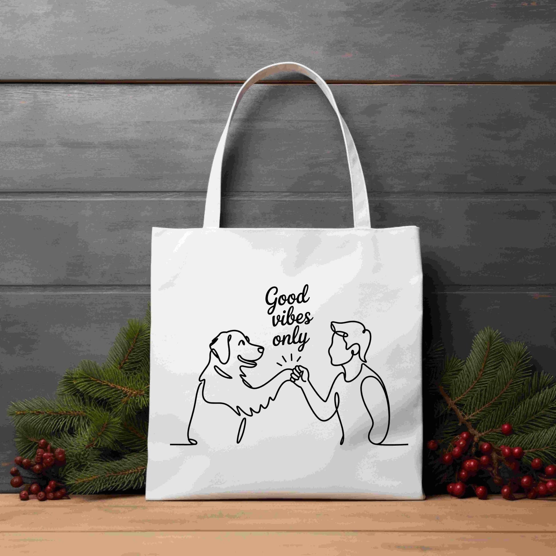 Minimalist one-line drawing of a person and dog fist bumping with the phrase “Good vibes only” above — digital PNG download